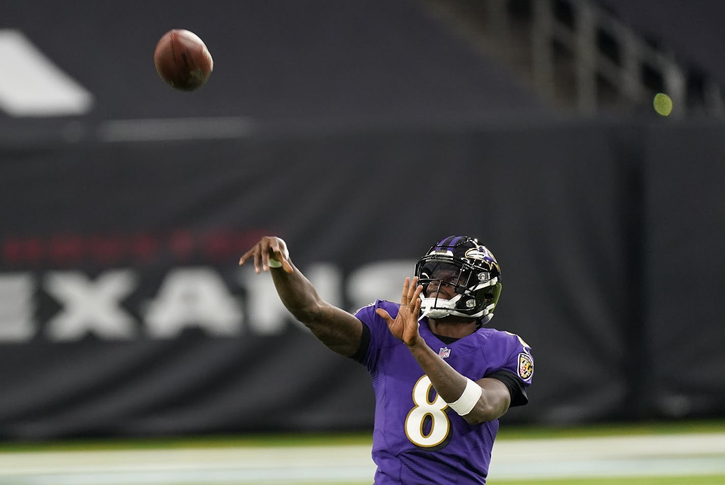 Baltimore Ravens quarterback Lamar Jackson warms up before an NFL football game against the Houston Texans Sunday, Sept.20, 2020, in Houston. (AP Photo/David J. Phillip)