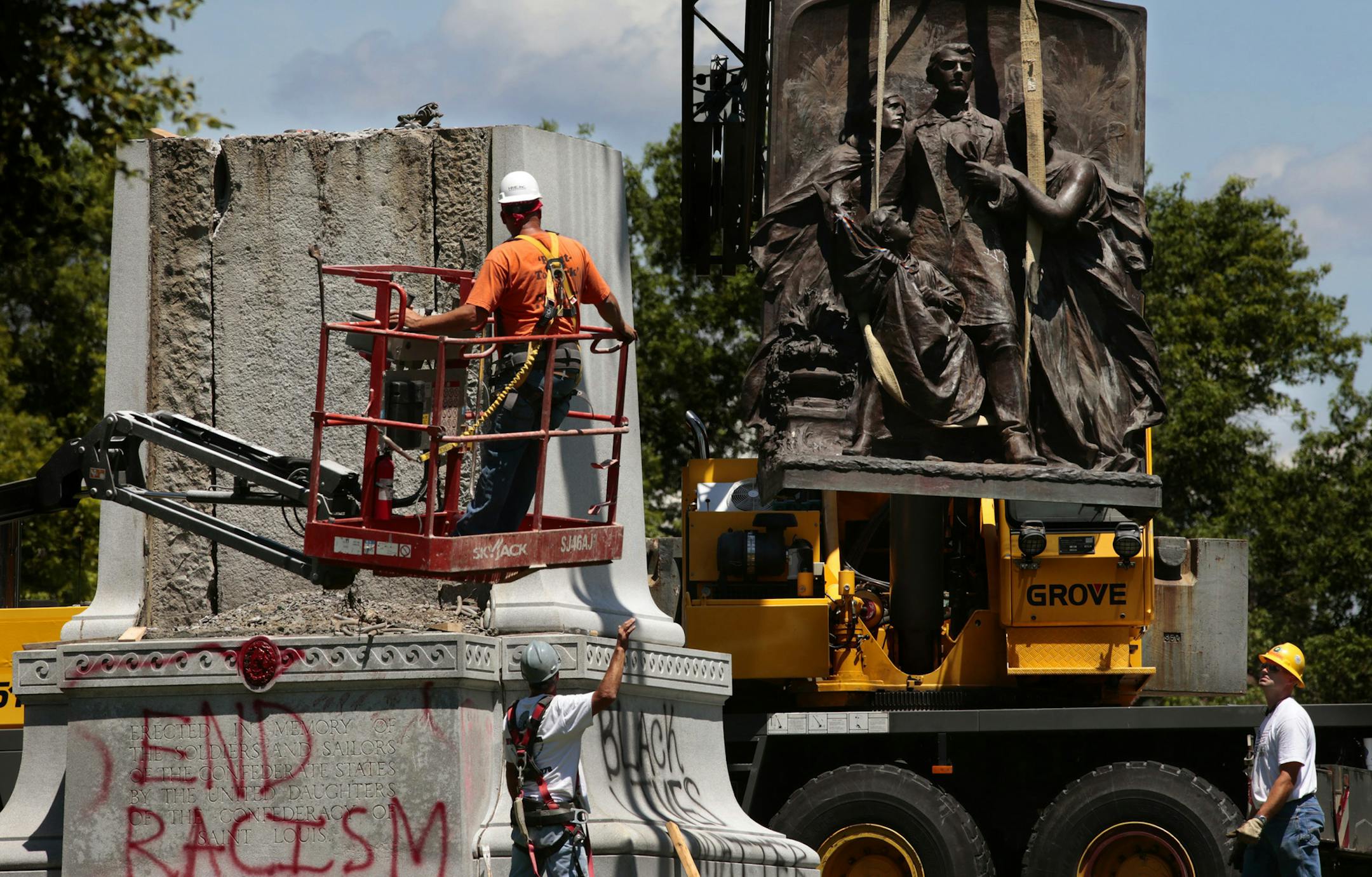 A crane removes bronze sculpture from the Confederate monument in Forest Park on Monday, June 26, 2017. In a settlement between St. Louis and the Missouri Civil War Museum, the museum agrees to remove the massive marker and store it until a new home is found outside of St. Louis City and County. (Robert Cohen/St. Louis Post-Dispatch/TNS) ORG XMIT: 1204925