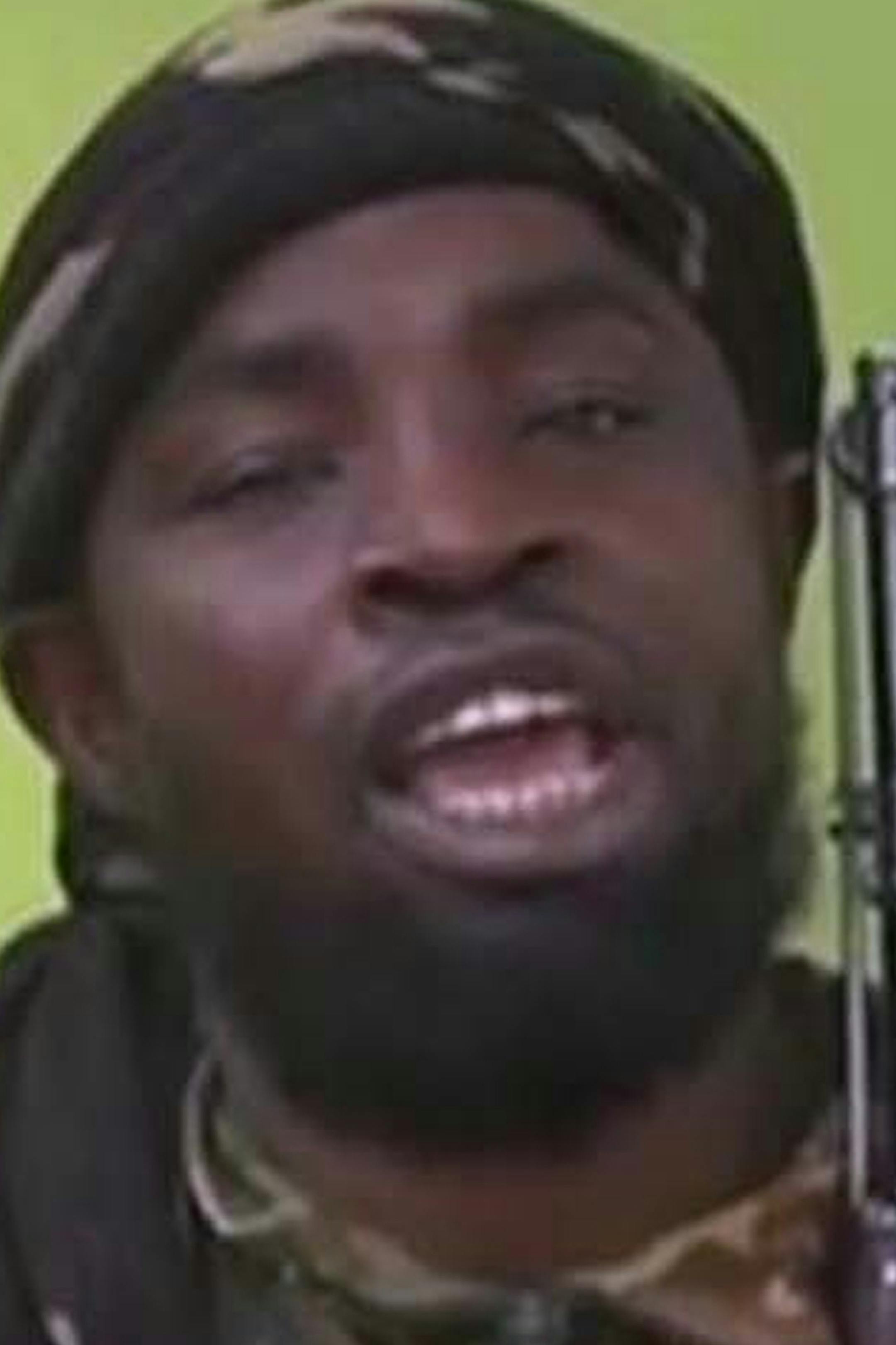 FILE - In this Monday May 12, 2014 file photo taken from video by Nigeria's Boko Haram terrorist network, shows their leader Abubakar Shekau speaking to the camera. the The military said Tuesday, Aug. 23, 2016, that Boko Haram leader Abubakar Shekau is believed to have been fatally wounded in an airstrike while he was praying in a forest stronghold in northeast Nigeria. (AP Photo/File)