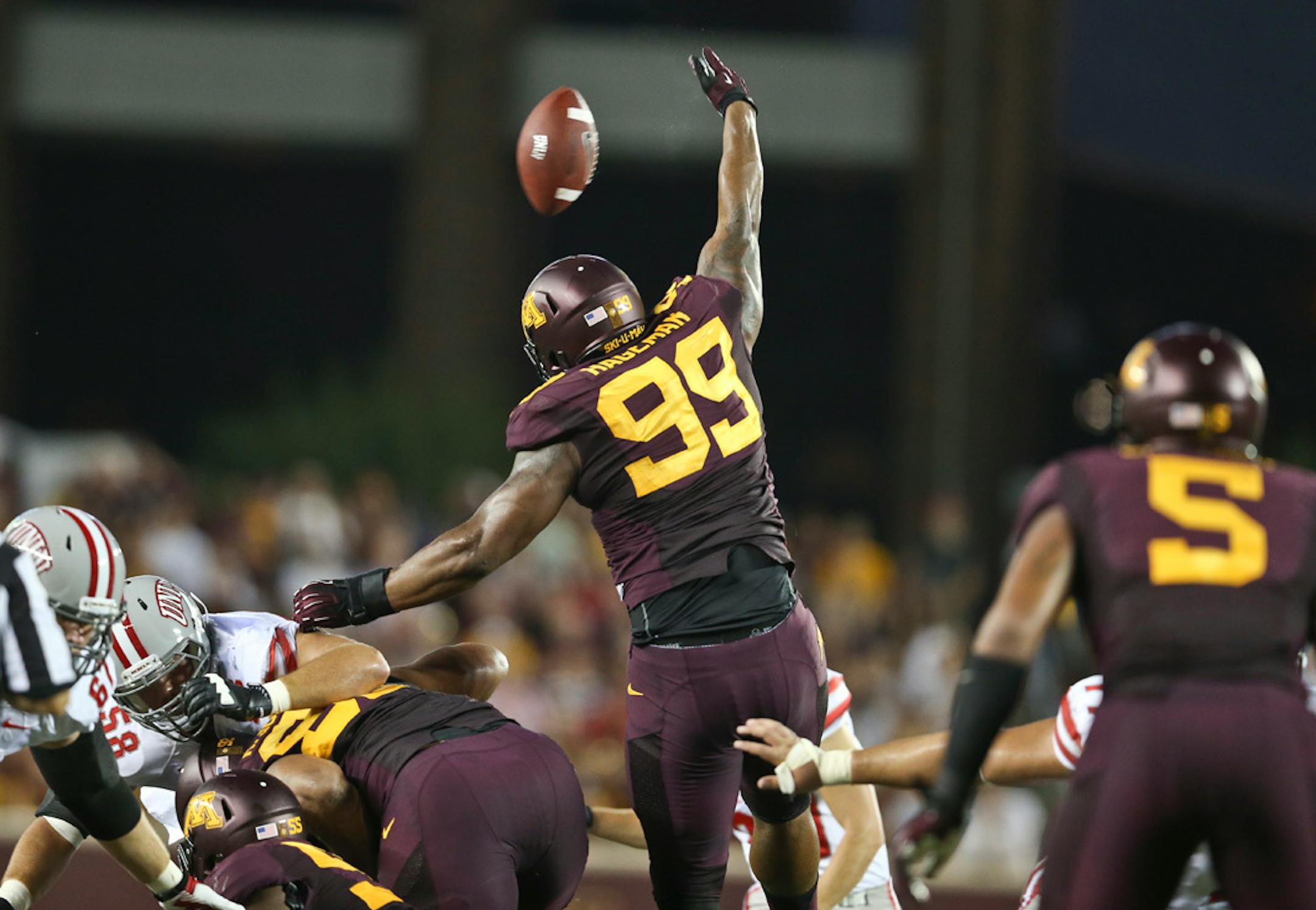Minnesota Golden Gophers defensive lineman Ra'Shede Hageman (99) blocked a UNLV field goal attempt, and after appearing to dribble the ball back up the field, Martez Shabazz gathered it and sprinted 51 yards for a touchdown in the third quarter during the Minnesota Gophers vs. UNLV in the season opener at TCF Bank Stadium at the University of Minnesota in Minneapolis, Minn.