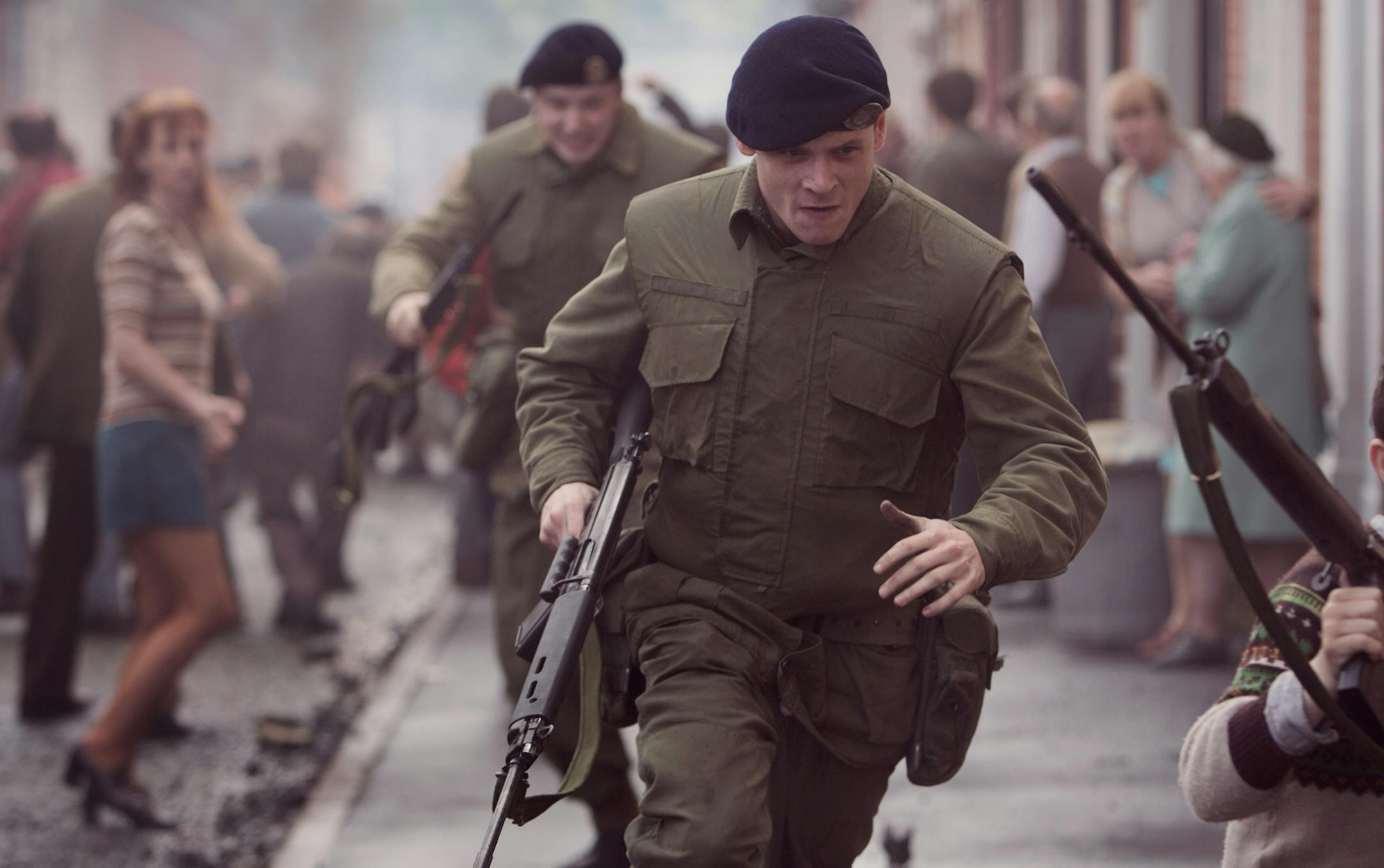 This image released by Roadside Attractions shows Jack O'Connell, center, in a scene from "71." (AP Photo/Roadside Attractions, Dean Rogers)
