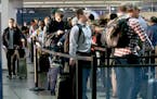 Travelers stood in the TSA screening line at MSP Airport, Monday, November 14, 2016 in Bloomington, MN. Travel is expected to increase nearly three pe