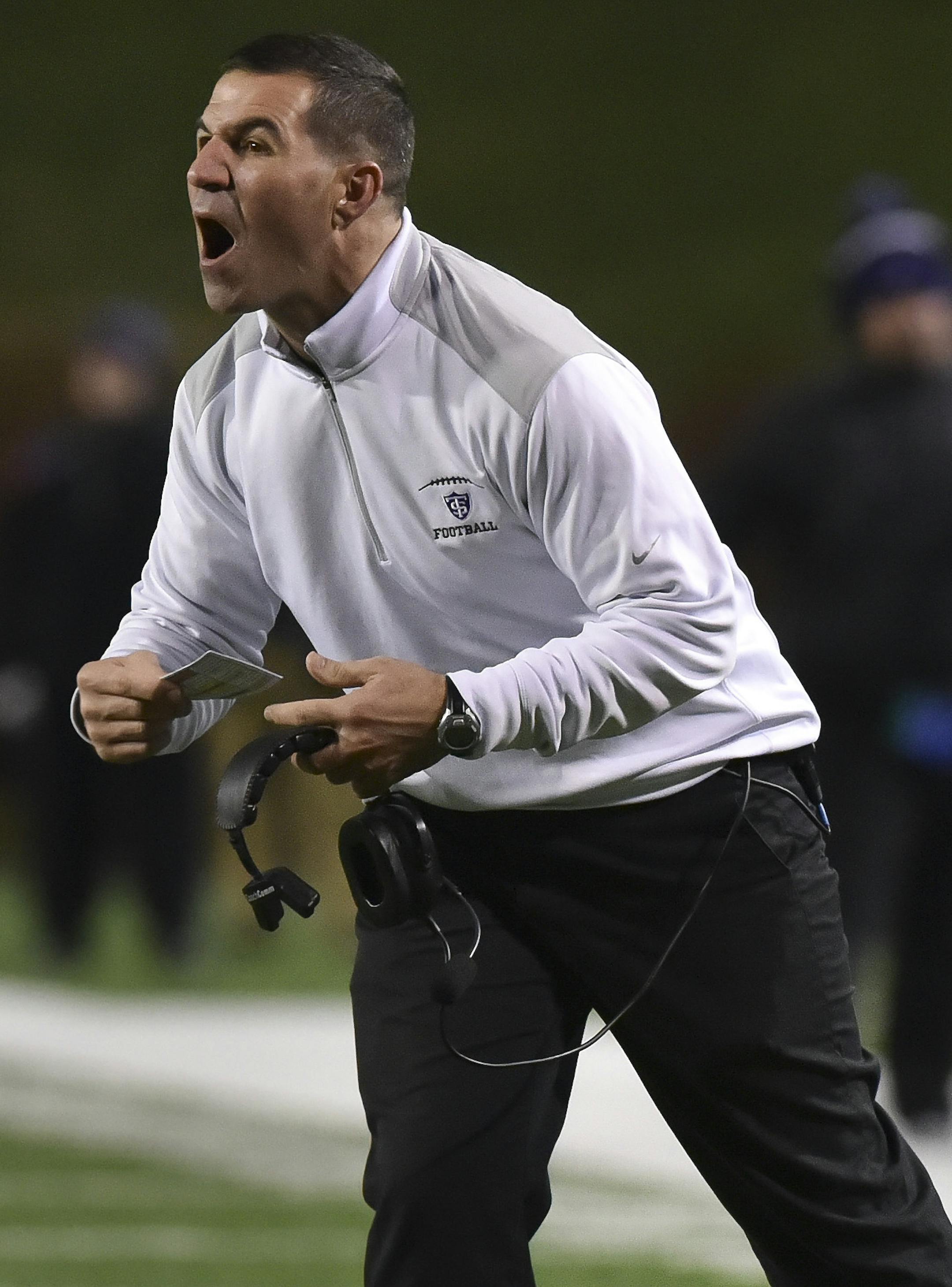 St. Thomas head coach Glenn Caruso reacts against Mount Union in the first half of the NCAA Division III football championship in Salem, Va., Friday, Dec. 18, 2015. (AP Photo/Michael Shroyer)