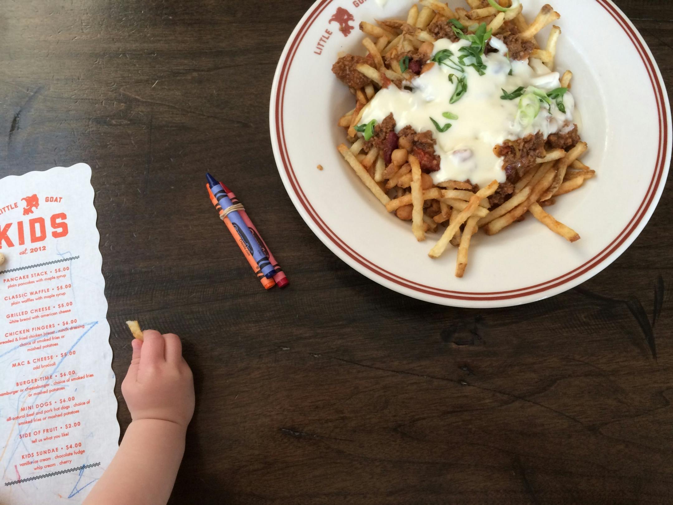 The casual diner atmosphere at Little Goat is perfect for children. There's a kids menu, but don't be surprised if they want to nibble the goat chili cheese fries off the adult menu too.