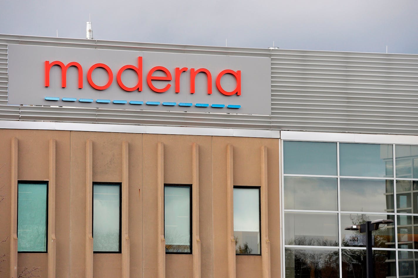 The Moderna logo is seen at the company's campus in Norwood, Massachusetts, on December 2, 2020, where the biotechnology company is mass producing its COVID-19 vaccine. The FDA has approved a third vaccine dose for immunocompromised people. (Joseph Prezioso/AFP/Getty Images/TNS) ORG XMIT: 24141749W