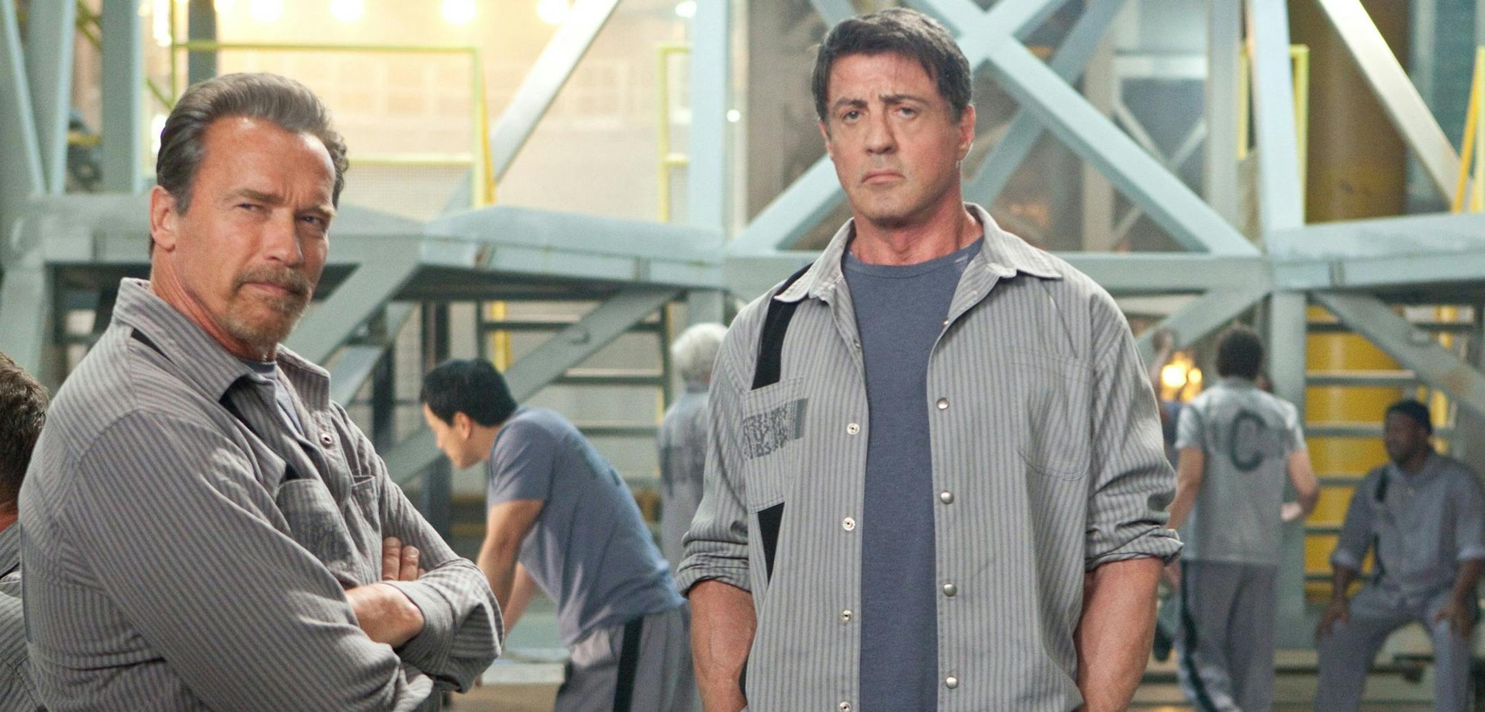 (Oct. 18) They're baaack: (L-R) Arnold Schwarzenegger and Sylvester Stallone are convicts in "Escape Plan." (Courtesy Alan Markfield/MCT) ORG XMIT: MIN1308281559088008
