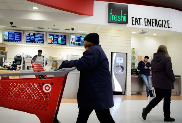Shoppers pass the new Freshii restaurant at the Target store on New Brighton Blvd, Minneapolis.