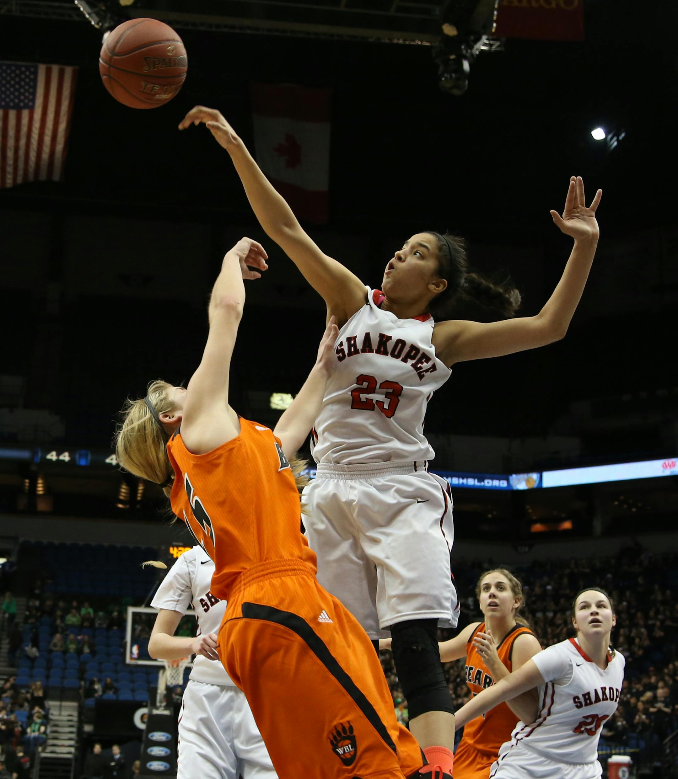 Shakopee's Mateya Hutton blocked the shot of White Bear Lake's Alison Hinck during the second half. ] (KYNDELL HARKNESS/STAR TRIBUNE) kyndell.harkness@startribune.com White Bear Lake vs Shakopee in the quarterfinals at the Target Center in Minneapolis Min., Tuesday, March 17, 2015. Shakopee won over White Bear Lake 62-56.