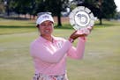 Lilia Vu holds up the trophy after winning the Meijer LPGA Classic on Sunday in Belmont, Mich.