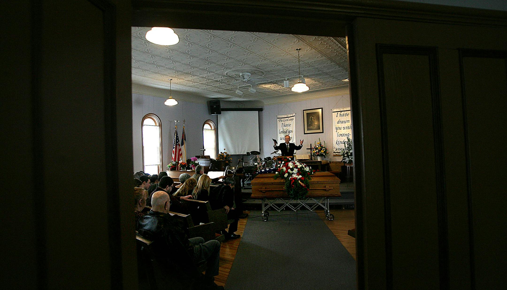 The Rev. Dale Rood invited mourners at the Seventh Day Baptist Church in Dodge Center to rise at the conclusion of a funeral ceremony for Claston E. (Classy) Bond, who was 85 when he passed away Sunday. Classy was in the Marine Corps and served in WWII.