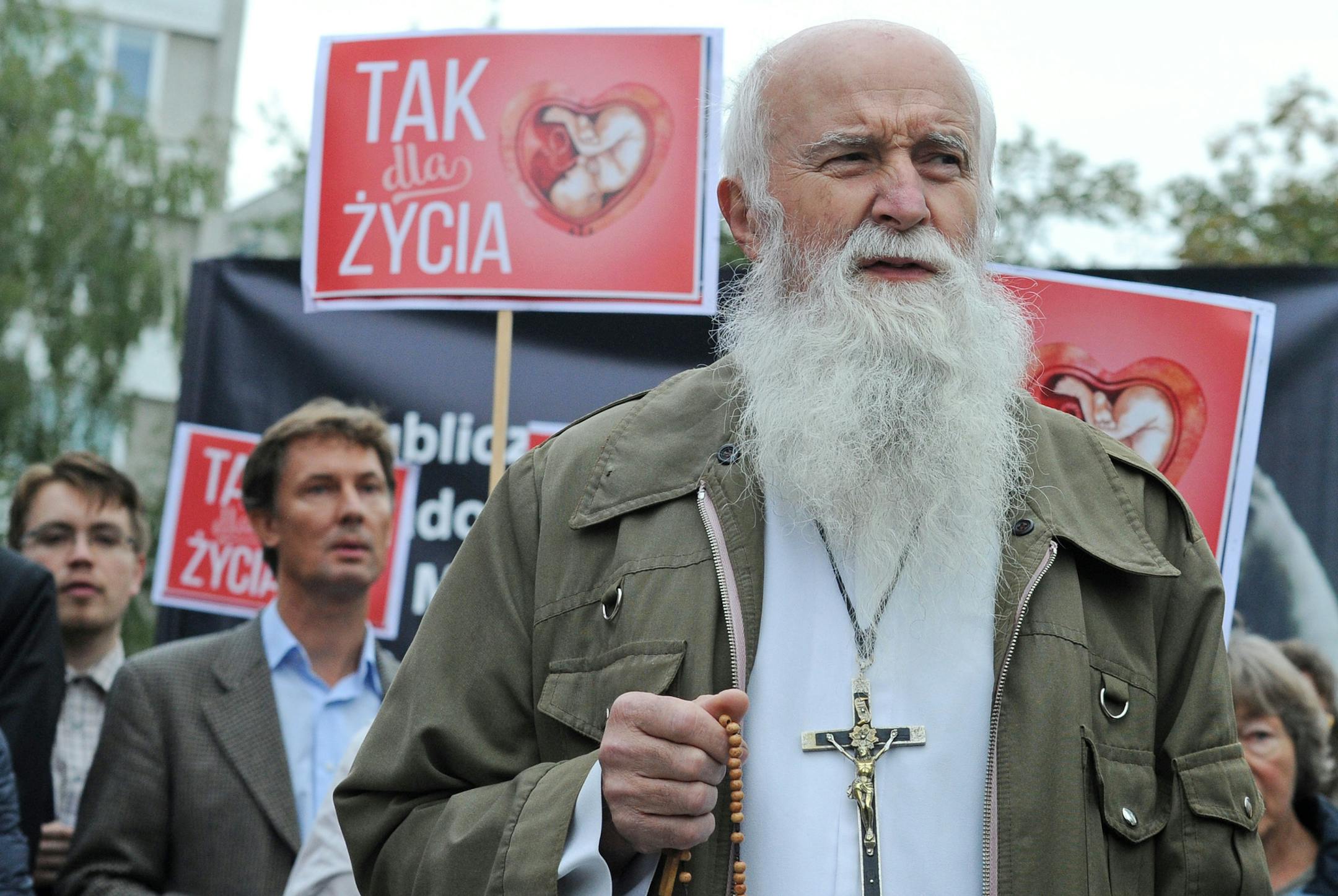 Anti abortion activists led by priests pray during a demonstration in front of the Polish parliament, in Warsaw, Poland, Thursday, Sept. 22, 2016. Poland’s lawmakers on Thursday opened a divisive debate on changing the restrictive anti-abortion law, among Europe’s toughest, in this predominantly Catholic nation.he placards read: Yes for Life. (AP Photo/Alik Keplicz)