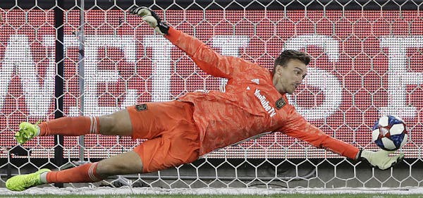 Los Angeles FC goalkeeper Tyler Miller stops a shot on goal by the San Jose Earthquakes during the second half of an MLS soccer match Wednesday, Aug. 
