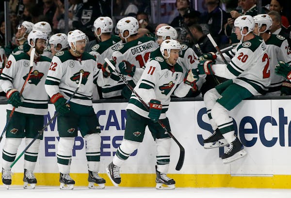 Wild left wing Zach Parise is congratulated by teammates after his goal during the second period against the Kings on Thursday.