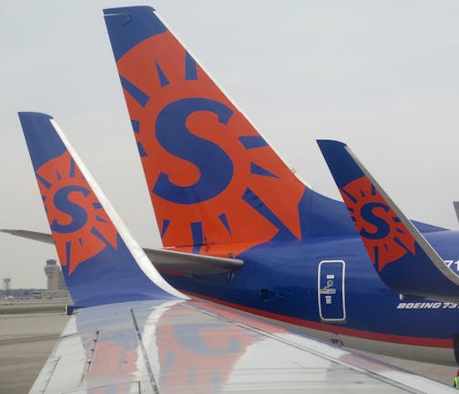 Sun Country airlines logo on 737 wing tips and tail at Humphrey terminal, MSP ] 2014 - for use with business related stories- illo ORG XMIT: MIN1407031432470341