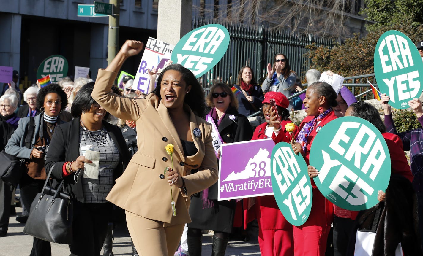 Momentum for passing the Equal Rights Amendment is building in Minnesota and other states. In this photo, Delegate Jennifer Carroll Foy, D-Price William, cheers on Equal Rights Amendment demonstrators outside the Capitol in Richmond, Va., Wednesday, Jan. 9.