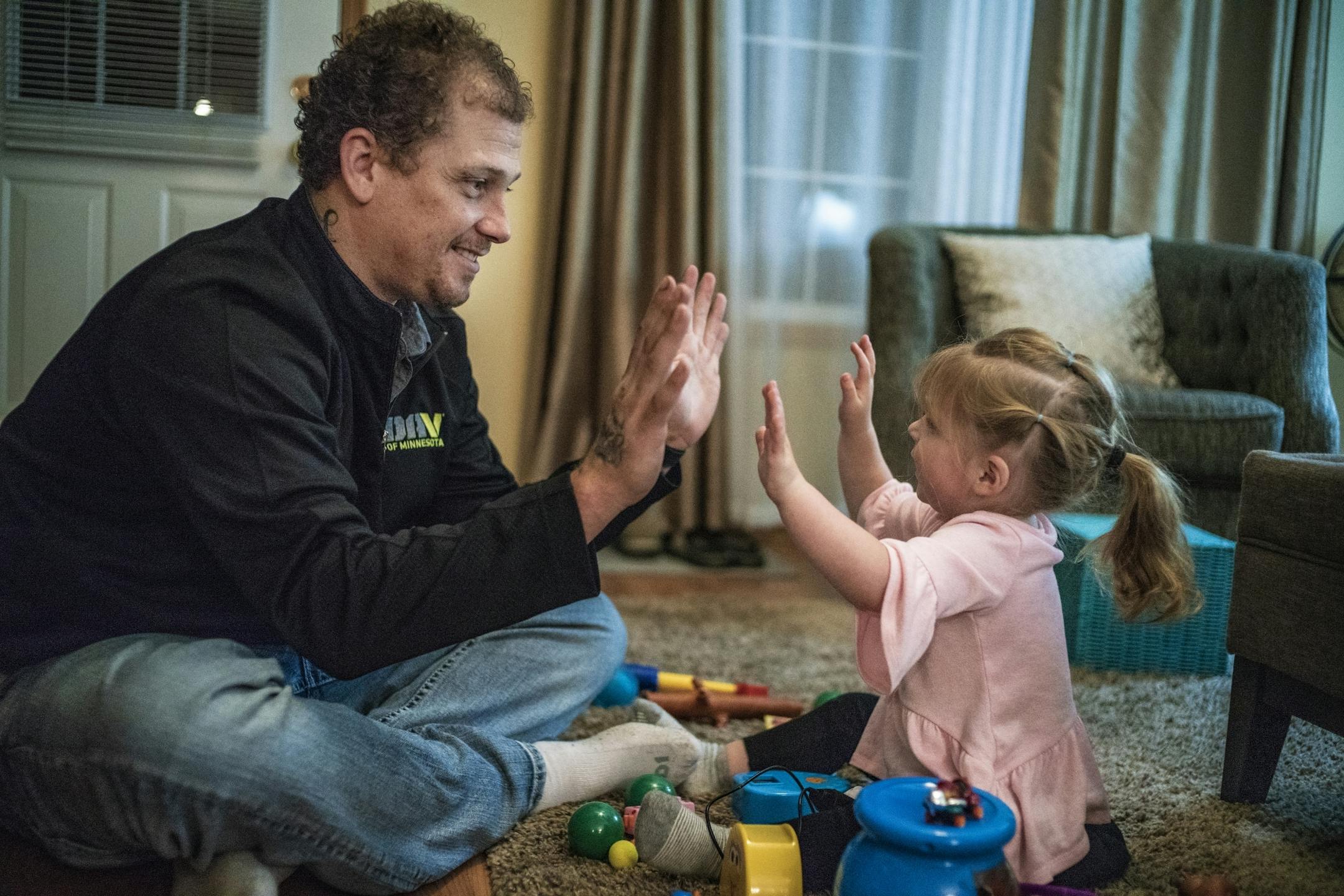 Alex Kempe plays with his youngest, daughter Sabriella,2.