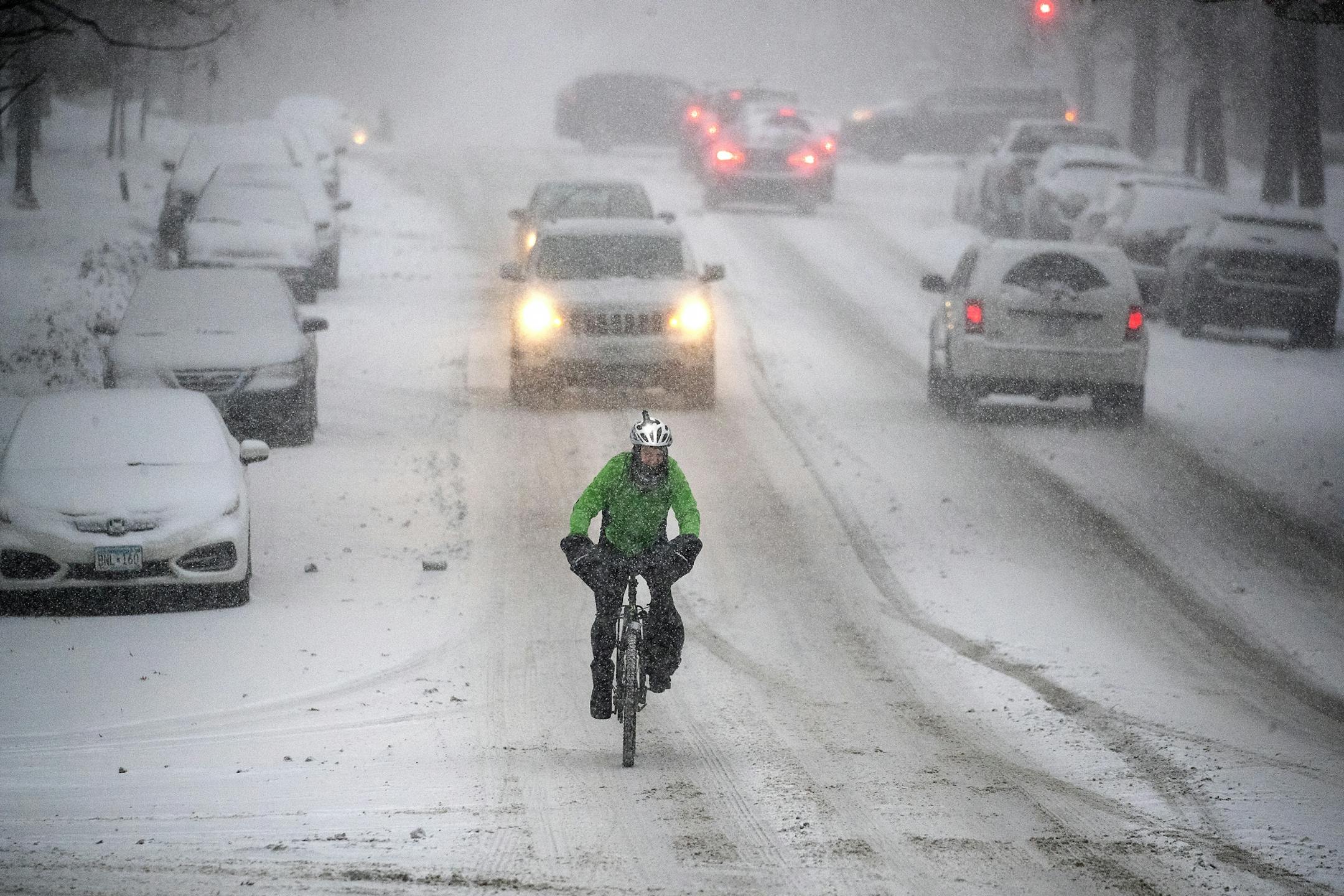 The morning commute either by car, bike or on foot was met with a snowy trek, Monday, December 9, 2019 in St. Paul, MN.