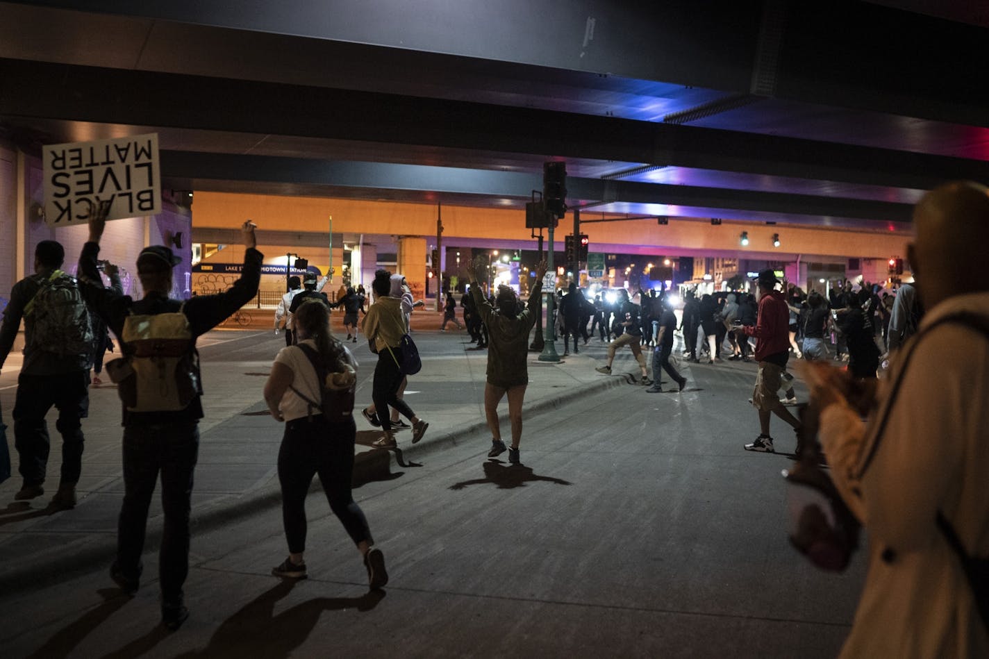 Polce shot smoke and tear gas at protesters on Lake Street at Hiawatha in Minneapolis, Minn., on Saturday, May 30, 2020.