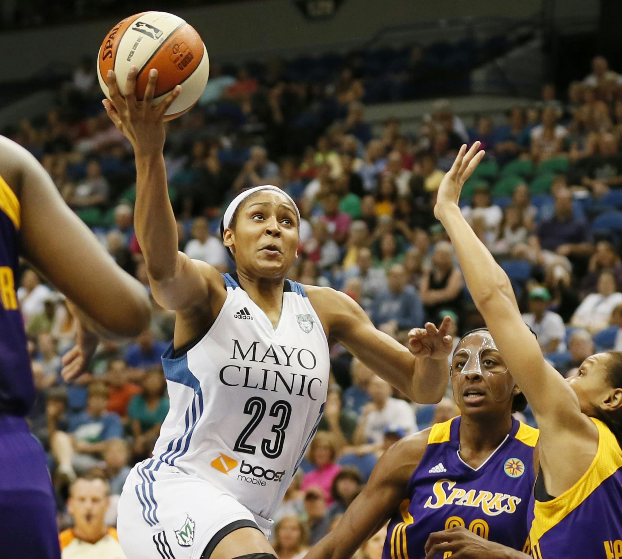 Maya Moore drove to the basket on Nneka Ogwumike, and Armintie Herrington of the Sparks during WNBA action between the Minnesota Lynx and Los Angeles Sparks at Target Center Tuesday July 8th 2014 in Minneapolis, MN. ] Jerry Holt Jerry.holt@startribune.com