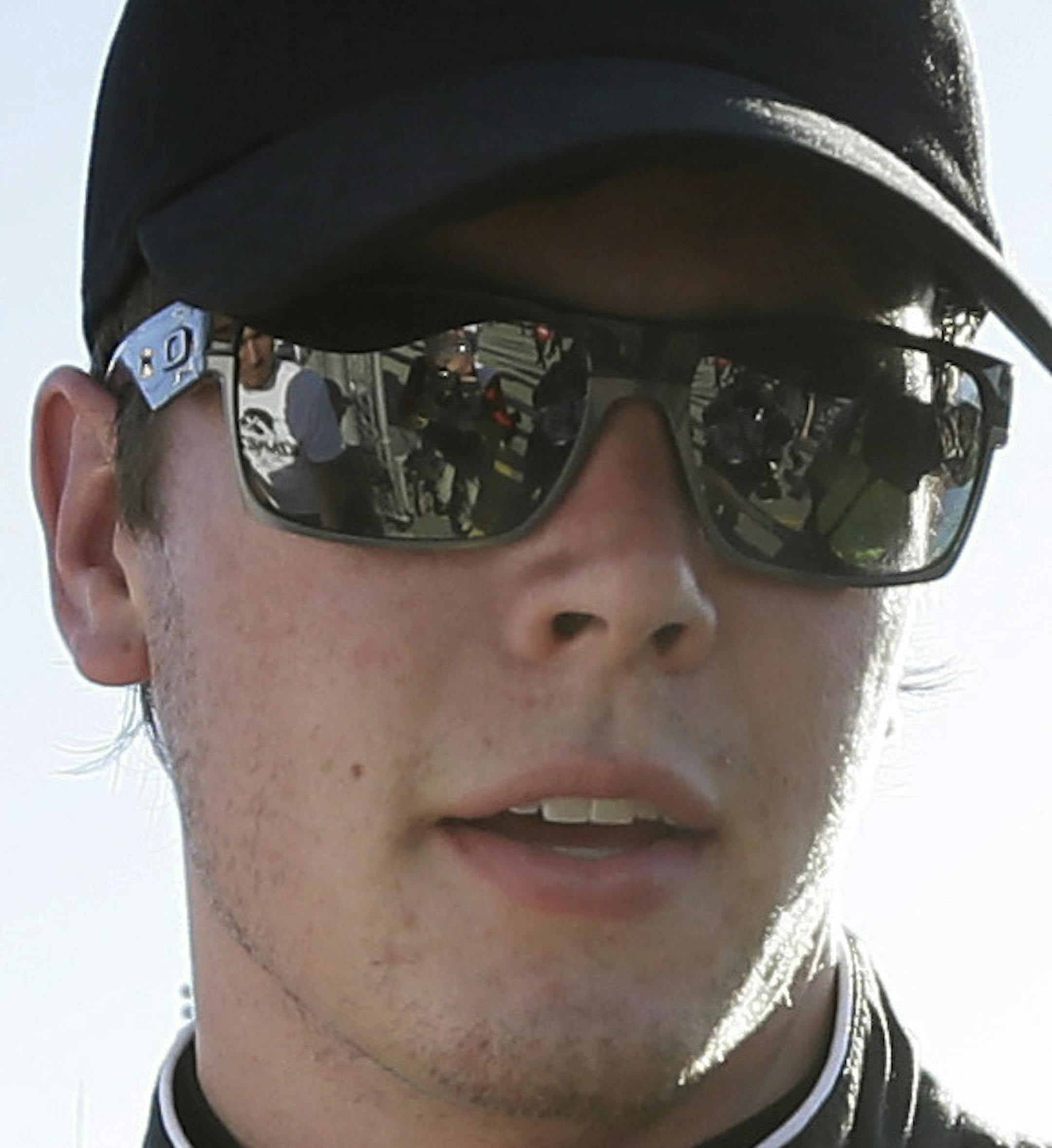 Erik Jones signs autographs after winning the pole position for the NASCAR Xfinity Series auto race, Saturday, June 18, 2016, at Iowa Speedway in Newton, Iowa. (AP Photo/Charlie Neibergall)