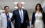 President Donald Trump, center, with first lady Melania Trump, right, and Dr. Igor Nichiporenko, left, spoke Friday while visiting Broward Health Nort