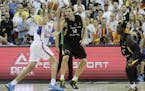 Serbia�s Nemanja Bjelica, left, goes for a shot over Germany�s Dirk Nowitzki, center, and Germany�s Dennis Schroeder, right, during the EuroBask