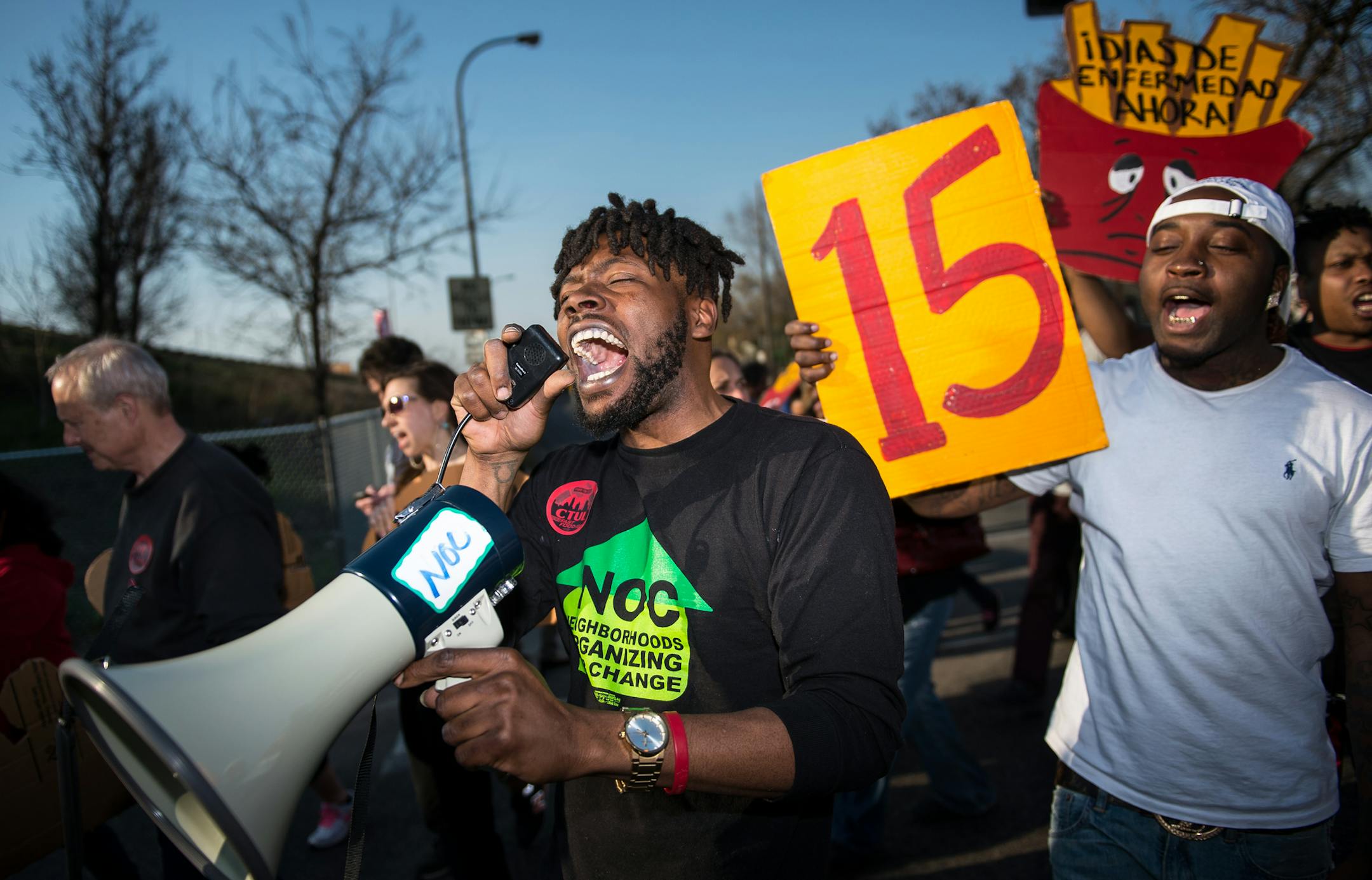 Rod Adams, economic justice organizer with Neighborhoods Organizing for Change, used his megaphone to advocate for increased wages for fast-food workers.