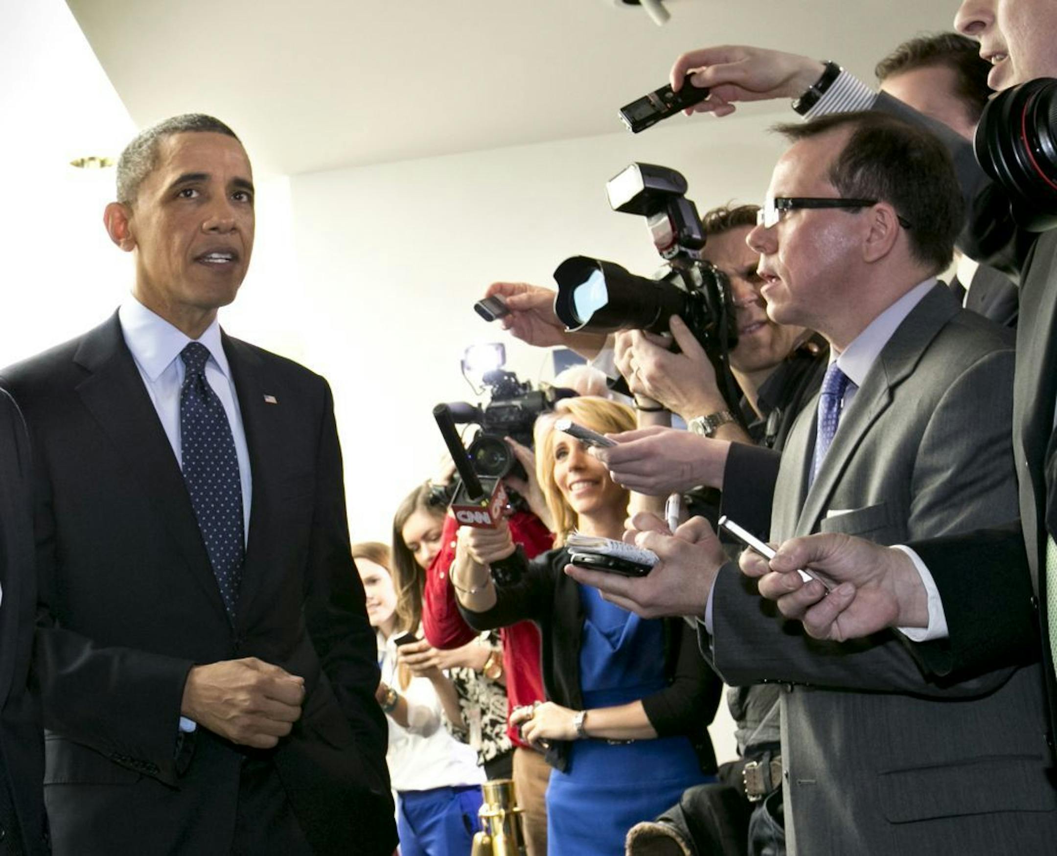 President Barack Obama turns to reporters as he leaves Capitol Hill in Washington, Wednesday, March 13, 2013, after his closed-door meeting with House Speaker John Boehner and Republican lawmakers to discuss the budget.