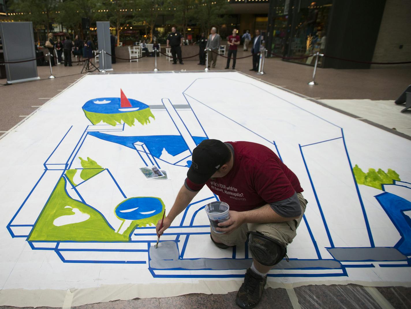 Local muralist Shawn McCann painted a 3D street scene in the plaza at the IDC Center in downtown Minneapolis, Minn. to commemorate The Minneapolis Foundation's Centennial, on Monday, April 6, 2015. The interactive painting will be finished Tuesday afternoon and on display through Friday. ] RENEE JONES SCHNEIDER &#xef; reneejones@startribune.com