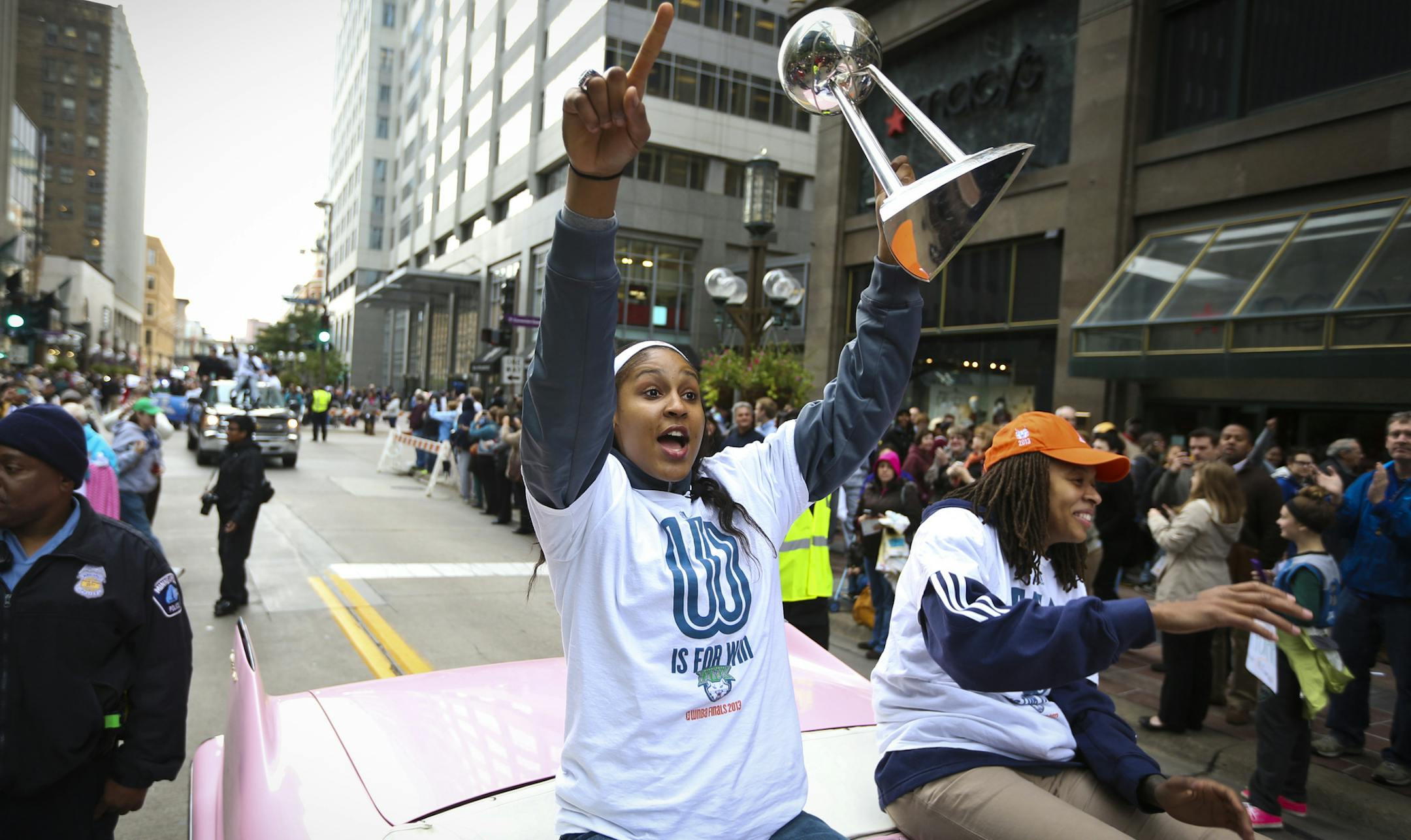 Lynx player Maya Moore raised up the trophy for the fans to see during a championship celebration parade for the WNBA champions on Monday, October 14, 2013, through downtown Minneapolis, Minn.] RENEE JONES SCHNEIDER • reneejones@startribune.com ORG XMIT: MIN1310141521026184