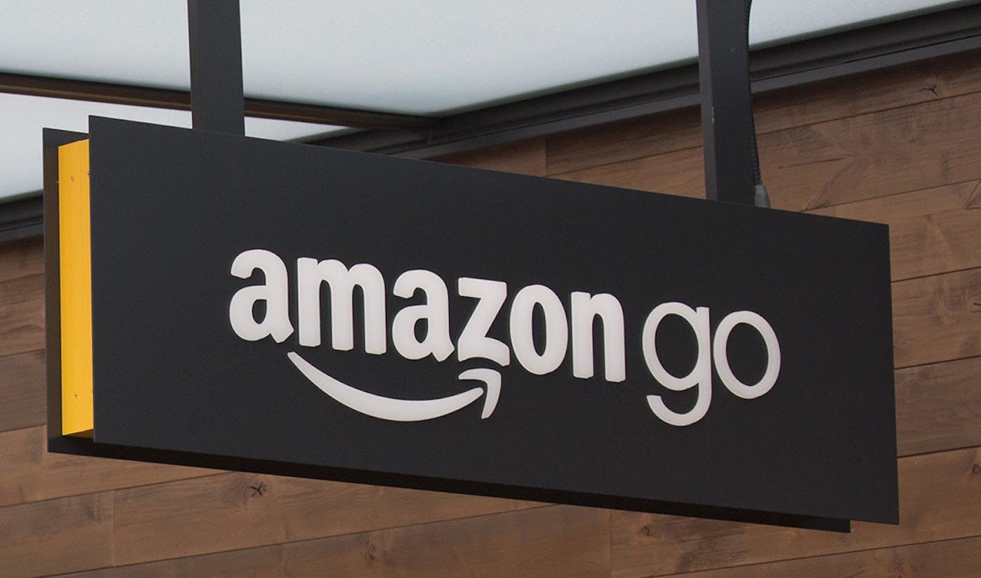 Signs for the Amazon Go grocery store in Seattle, Dec. 5, 2016. At the experimental store on the ground floor of a new Amazon office building, shoppers will be able to pluck what they want off the shelves and leave without waiting to pay. (David Ryder/The New York Times) ORG XMIT: MIN2016122814292024