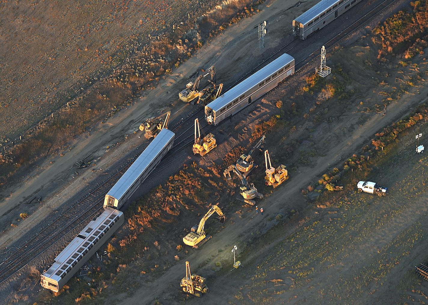 This aerial view taken Sunday, Sept. 26, 2021, shows part of an Amtrak train that derailed in north-central Montana Saturday that killed multiple people and left others hospitalized, officials said. The westbound Empire Builder was en route to Seattle from Chicago, with two locomotives and 10 cars, when it left the tracks about 4 p.m. Saturday. (Larry Mayer/The Billings Gazette via AP)