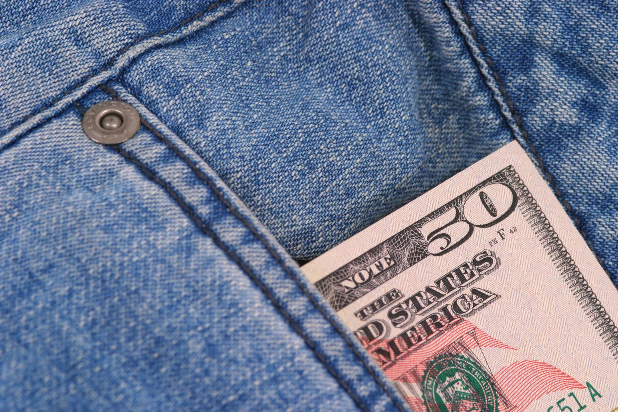 50 Dollars in denim jean pocket