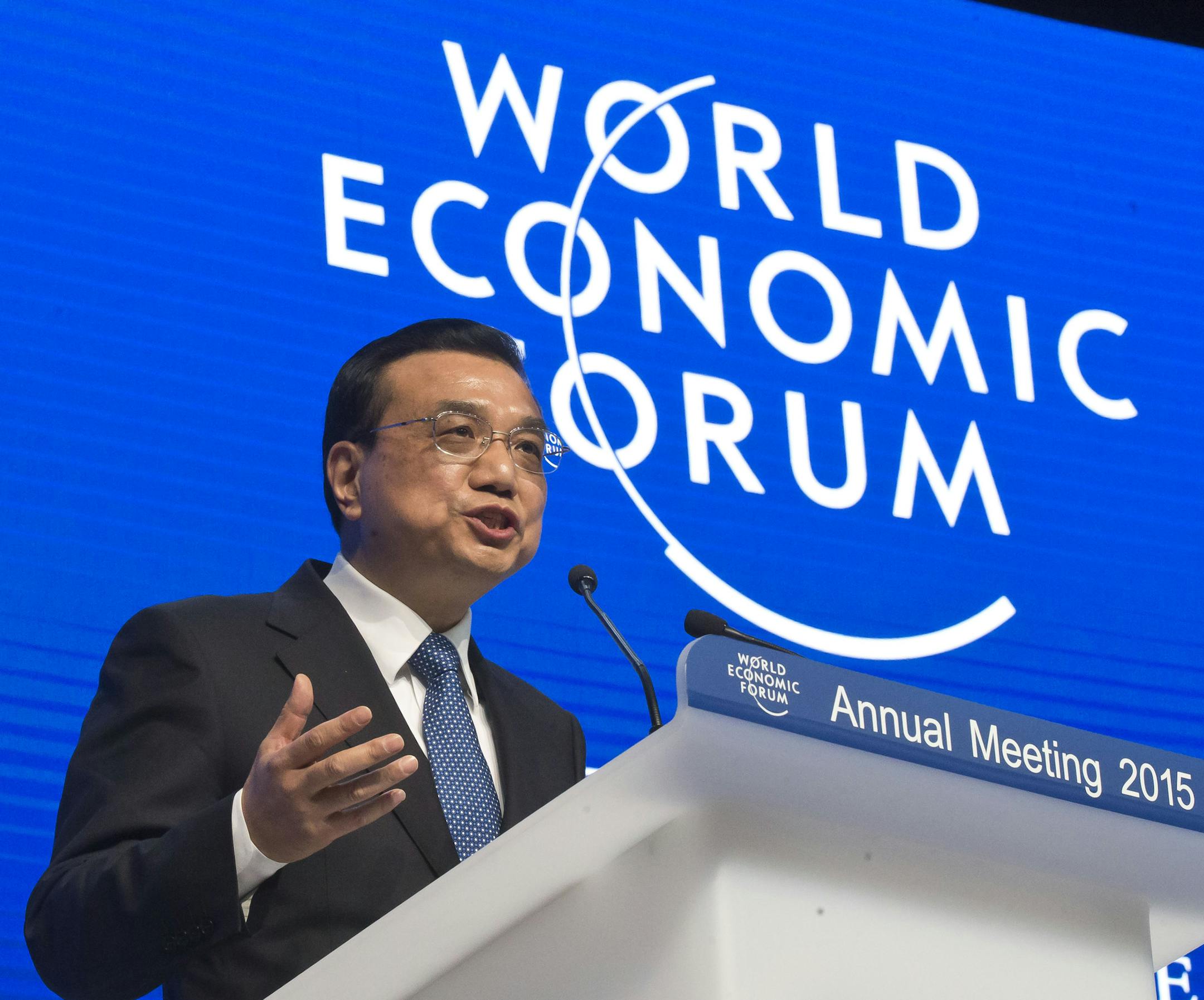 Chinese Premier Li Keqiang gestures as he speaks during the panel "The Global Impact of China's Economic Transformation" in Davos, Switzerland, Wednesday, Jan. 21, 2015. The meeting runs Jan. 21 through 24 under the overarching theme "The New Global Context". (AP Photo/Michel Euler) ORG XMIT: MEU140