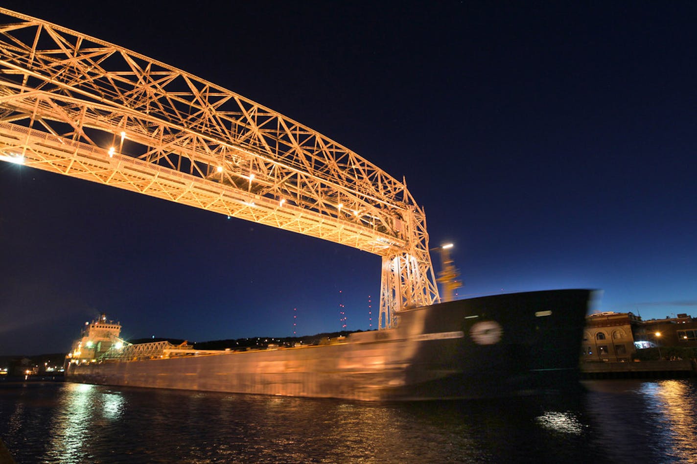 A freighter sailed under the Lift Bridge in Duluth in this file photo. Business at the port is up, the Marine Chamber of Commerce said.