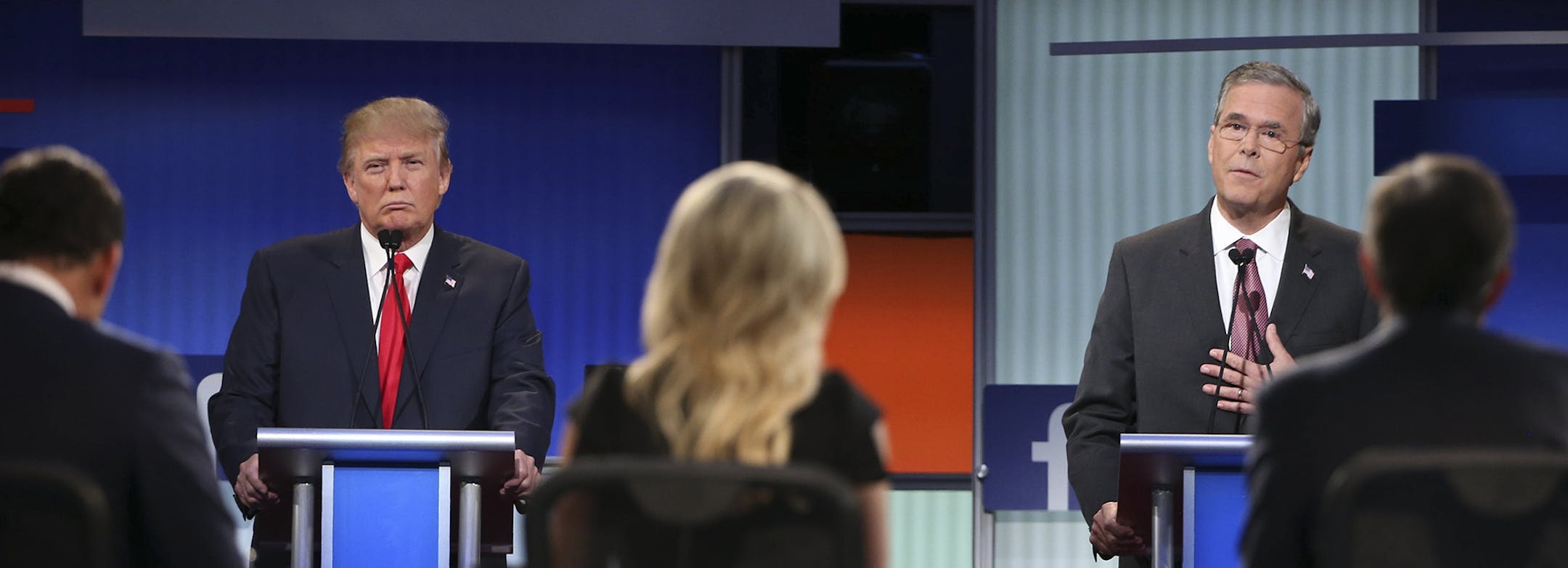 Donald Trump, the real estate mogul and television personality, and Jeb Bush, the former governor of Florida, participate in a debate of ten leading Republican presidential hopefuls, at the Quicken Loans Arena in Cleveland, Aug. 6, 2015. (Doug Mills/The New York Times) ORG XMIT: MIN2015080711510420