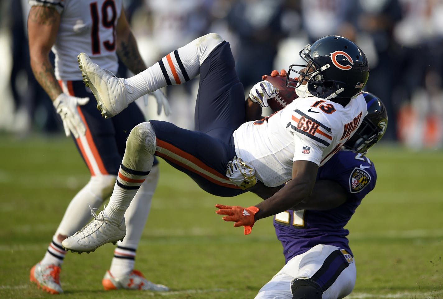 Chicago Bears wide receiver Kendall Wright (13) is tackled by Baltimore Ravens free safety Lardarius Webb in an overtime period of an NFL football game, Sunday, Oct. 15, 2017, in Baltimore. (AP Photo/Nick Wass) ORG XMIT: OTK