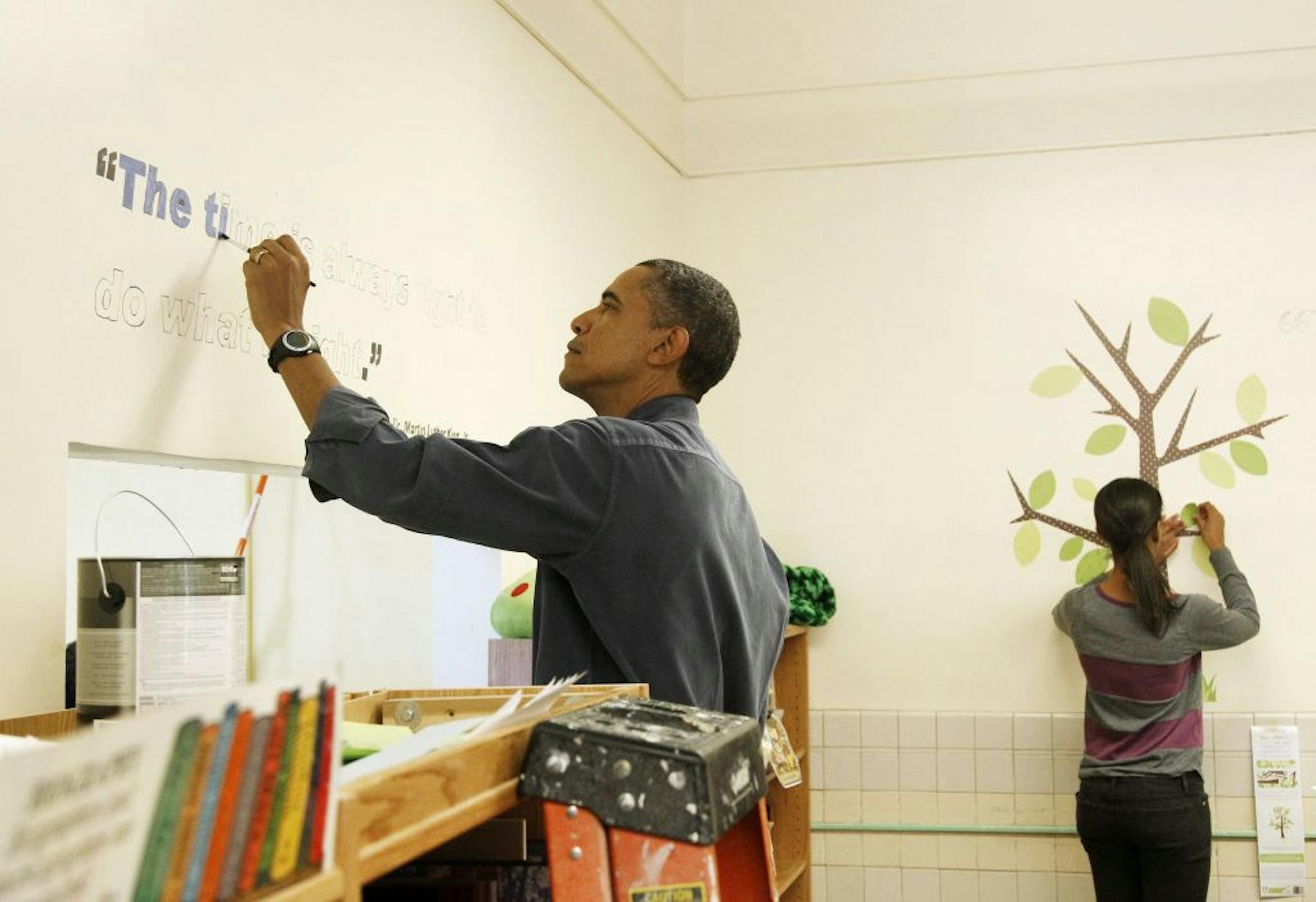 President Obama and daughter Malia participated in a community service project at a Washington, D.C., school in honor of Martin Luther King Jr.
