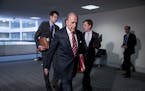 White House chief economic adviser Larry Kudlow arrives for a meeting to discuss the coronavirus relief bill on Capitol Hill, Friday, March 20, 2020, 
