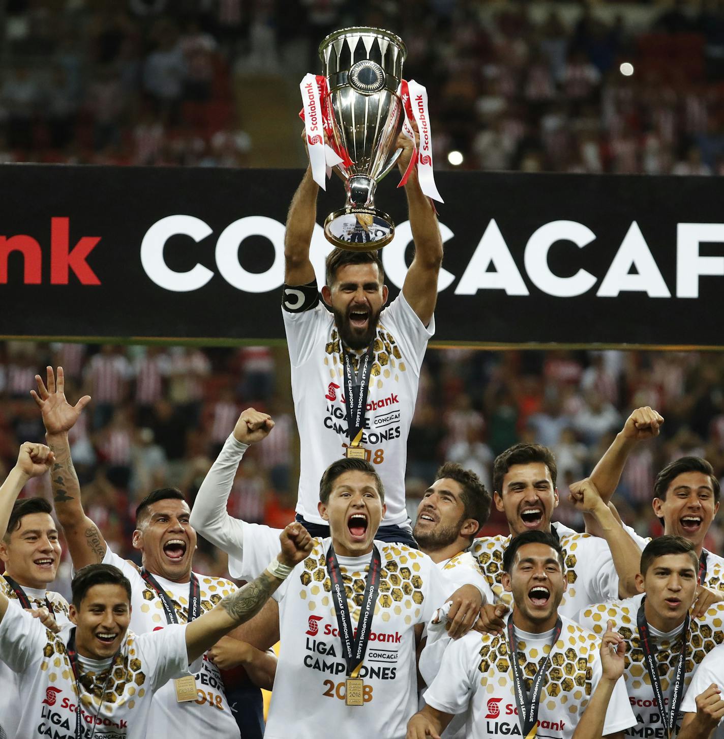 Chivas players hold the trophy aloft as they celebrate winning the CONCACAF Champions League final soccer match in Guadalajara, Mexico, Wednesday, April, 25, 2018. Chivas defeated Toronto FC in a penalty shoot out. (AP Photo/Eduardo Verdugo)