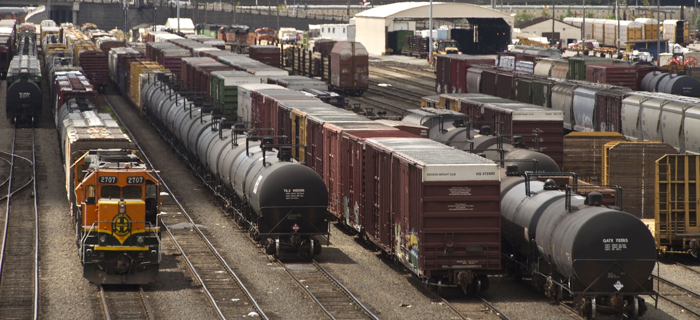 FILE -- In this June 20, 2013 file photo, black tank cars used to transport crude oil from North Dakota are parked among other rail traffic at a train yard in Tacoma, Wash. Washington lawmakers on Monday, Feb. 10, 2014, are considering competing measures that try to address safety issues surrounding the increased number of crude oil trains moving throughout the state. The Senate Ways and Means Committee is taking testimony on a mostly Republican-backed bill. Meanwhile, the House Appropriations C