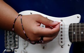 FILE - The weeklong program weaves together modern instruments and traditional knowledge, with campers receiving music instruction each day alongside