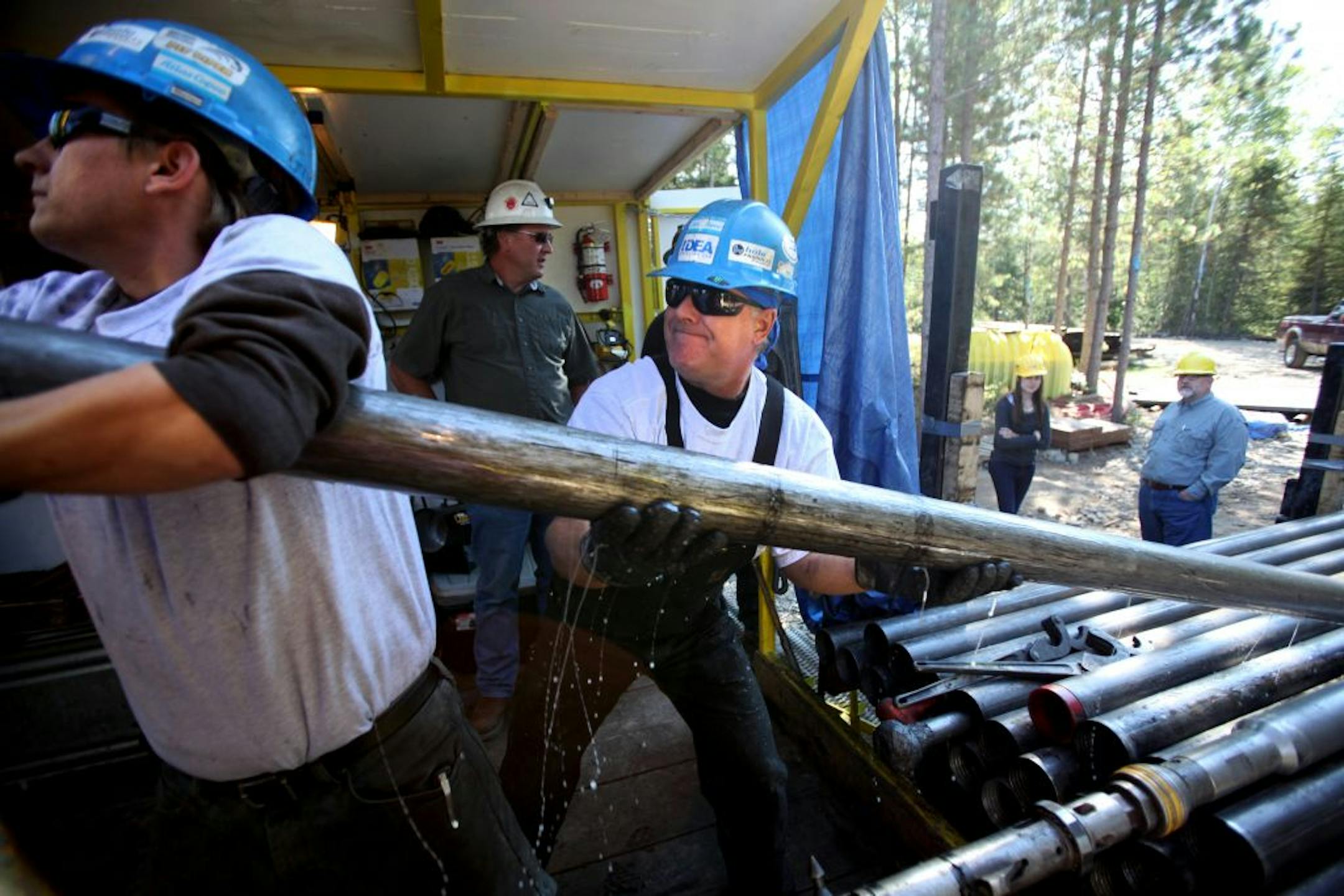 Eric Nilsson, left, and Craig Duncan helped
take a core sample last year near Ely, Minn.