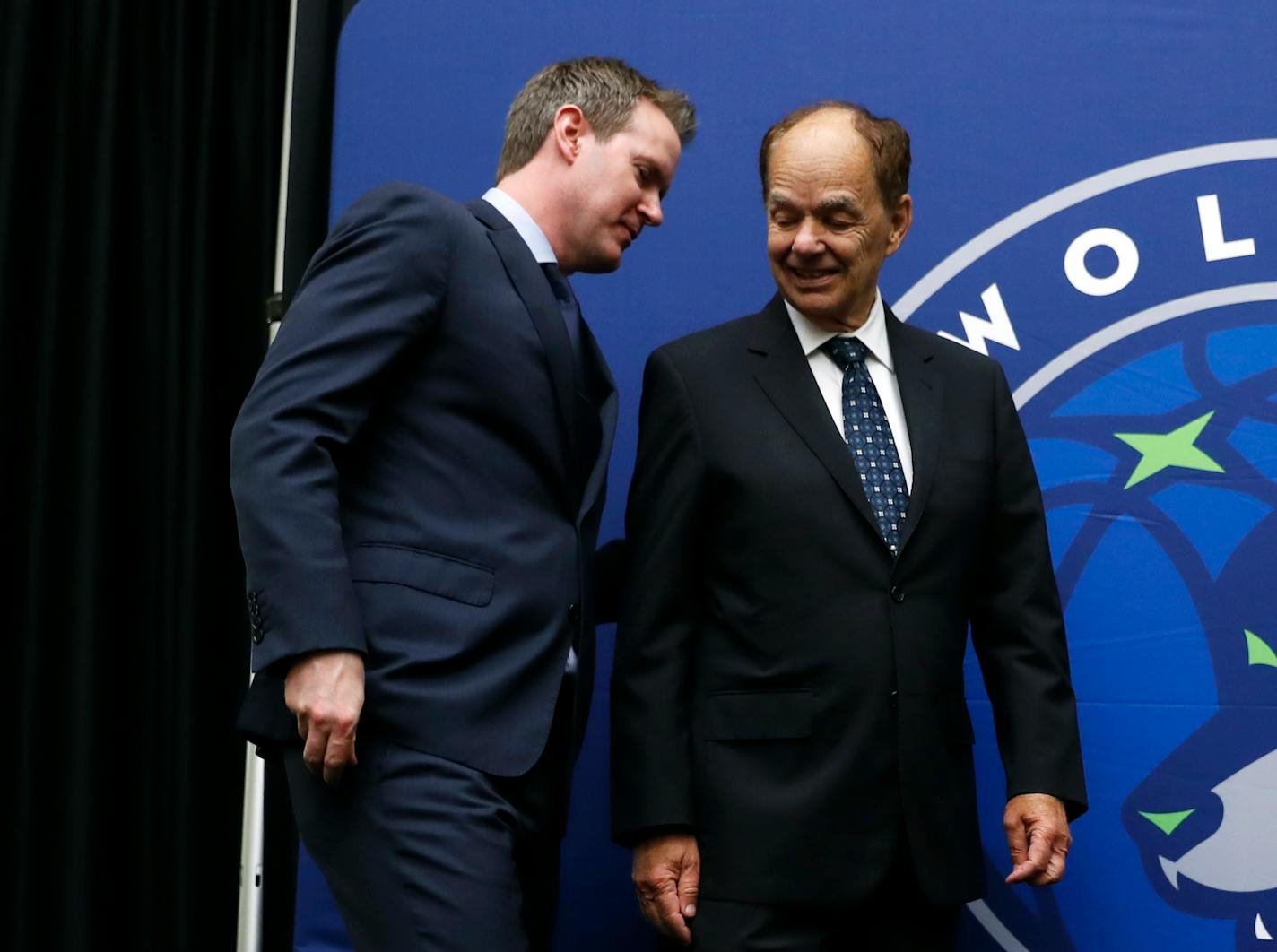 Minnesota Timberwolves CEO Ethan Casson, left, talks with Timberwolves majority owner Glen Taylor following a news conference, Tuesday, May 30, 2017, in Des Moines, Iowa. The Timberwolves, who recently purchased the Iowa Energy D-League franchise, unveiled their new affiliate's name, logo and colors. (AP Photo/Charlie Neibergall)