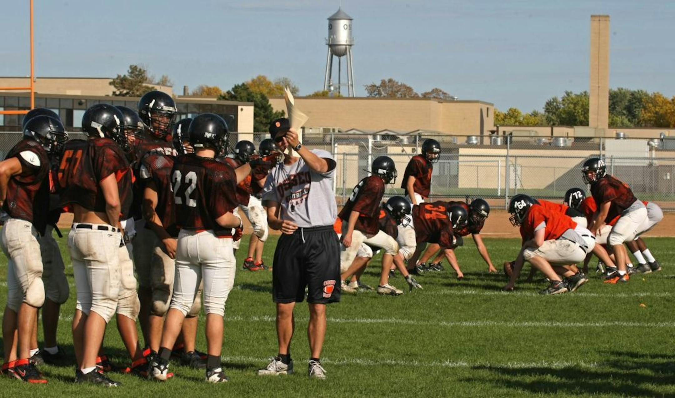 The Osseo High School football team ran through blocking drills during practice after school.