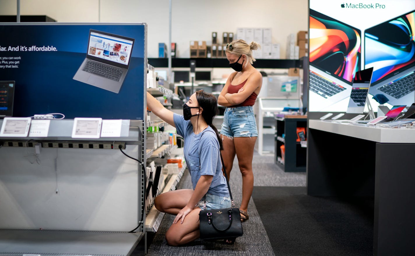 Brianna Reinarts, left, a senior at the University of St. Thomas, and Mackenzie Turner, a senior at the University of Minnesota, shopped at Best Buy in Roseville for a new computer for Brianna.