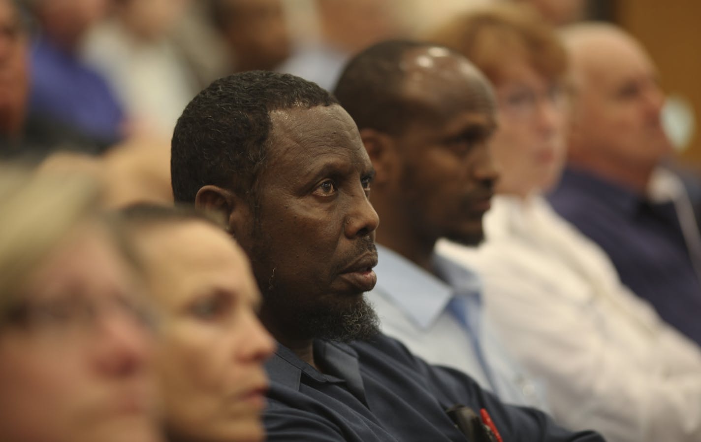 Mohamed Amed listened during a city council meeting as they decided on a proposed Islamic center in St Anthony Village, Min., Tuesday, June 12, 2012.