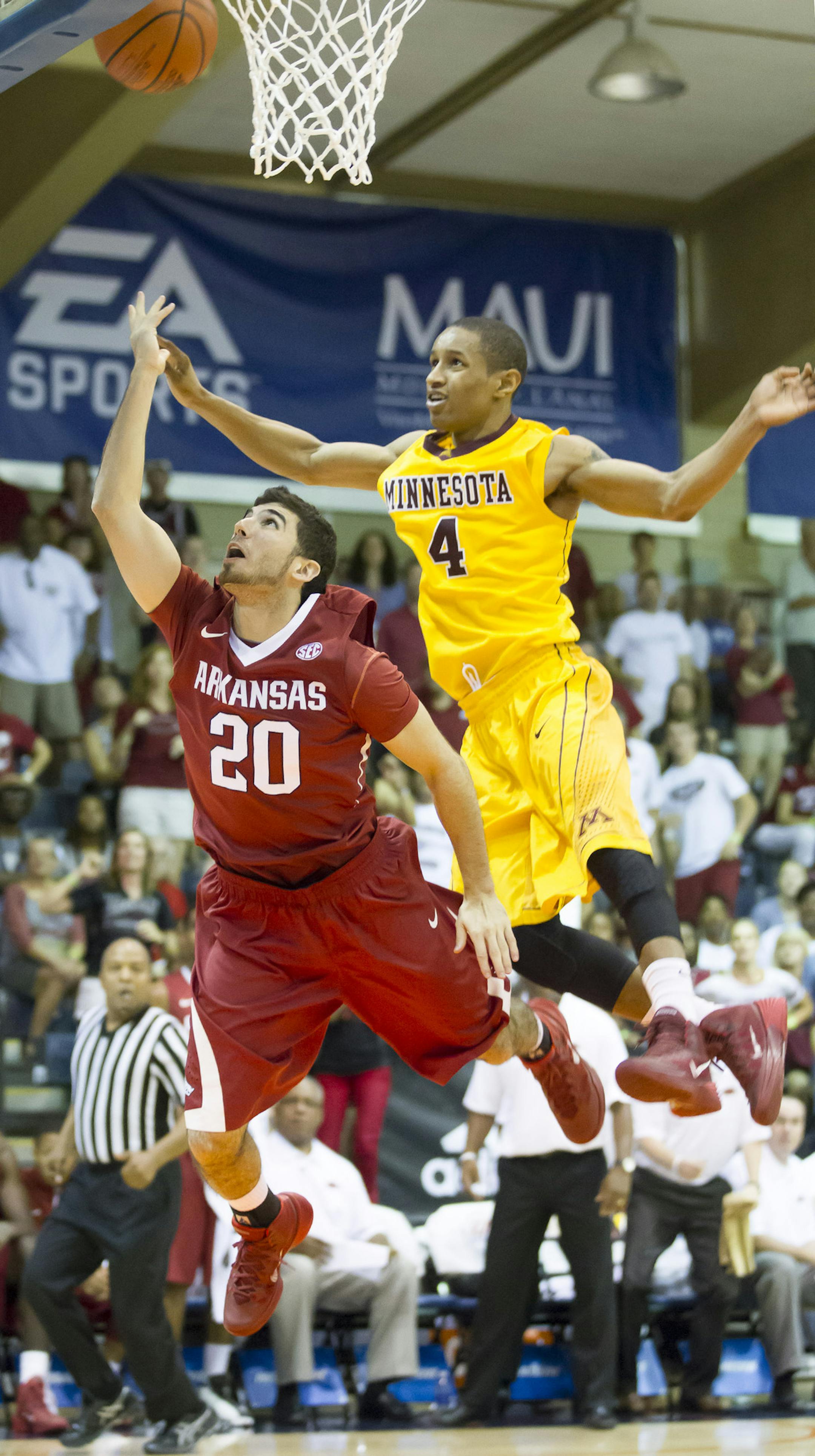 Arkansas guard Kikko Haydar (20) shoots as Minnesota guard Deandre Mathieu (4) defens in the second half of an NCAA college basketball game at the Maui Invitational on Tuesday, Nov. 26, 2013, in Lahaina, Hawaii. Arkansas won 87-73. (AP Photo/Eugene Tanner)