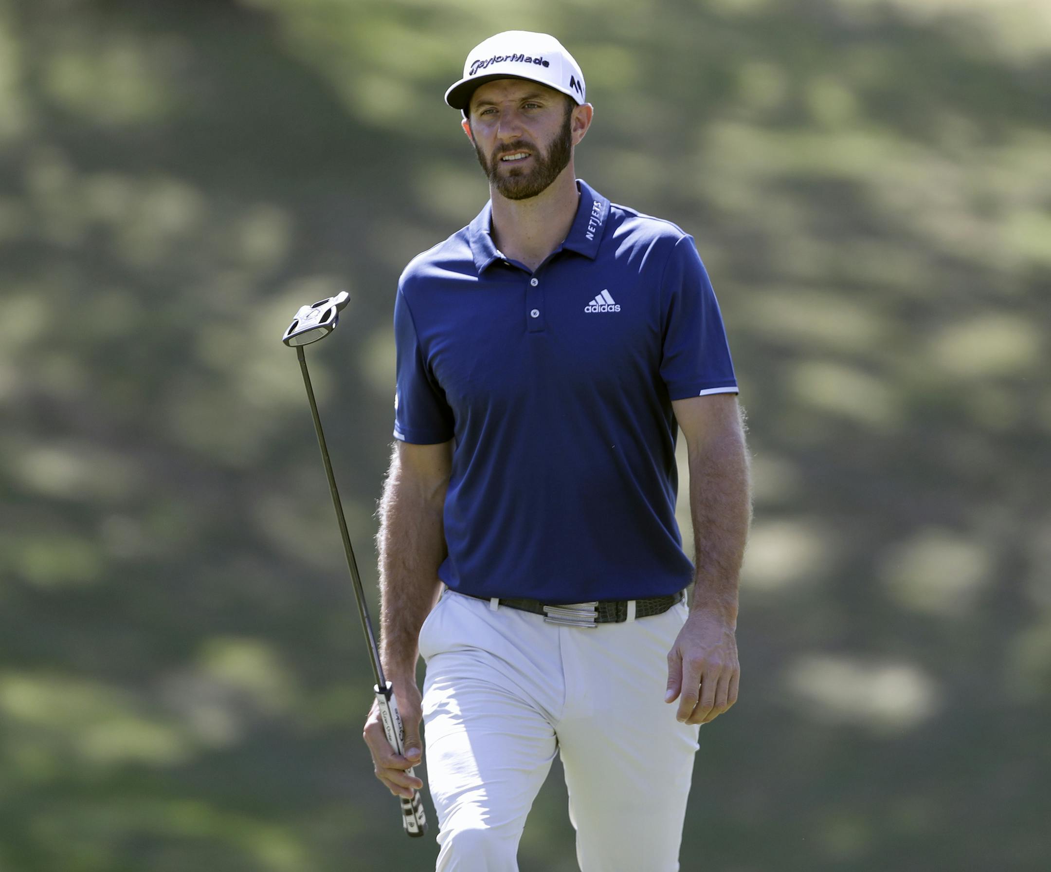 Dustin Johnson walks to the 18th green during a practice round for the Dell Match Play Championship golf tournament at Austin County Club, Tuesday, March 21, 2017, in Austin, Texas. (AP Photo/Eric Gay)
