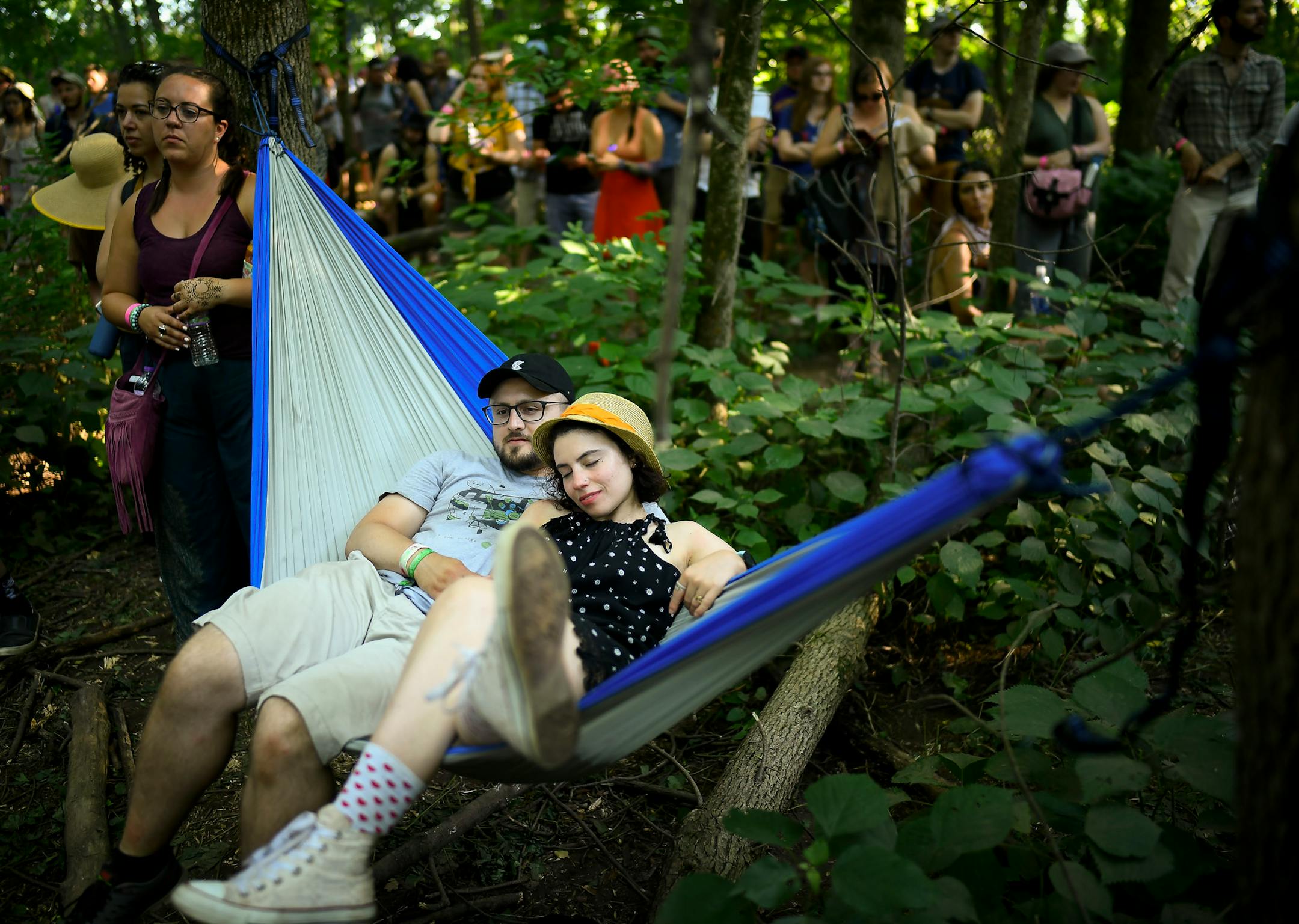 Joanna Rozemberg and Ricky Ayala, of Chicago, relaxed in a hammock while listening to Gordi's performance at the Oxbeaux stage. ] AARON LAVINSKY ï aaron.lavinsky@startribune.com Day two of the Eaux Claires Music & Art Festival was held Saturday, July 7, 2018 at Foster Farms in Eau Claire, Wisc.